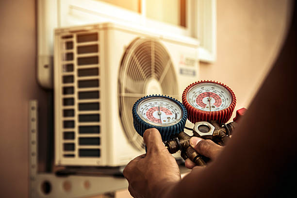 Professional Ac Installation technician working in Deatsville, AL